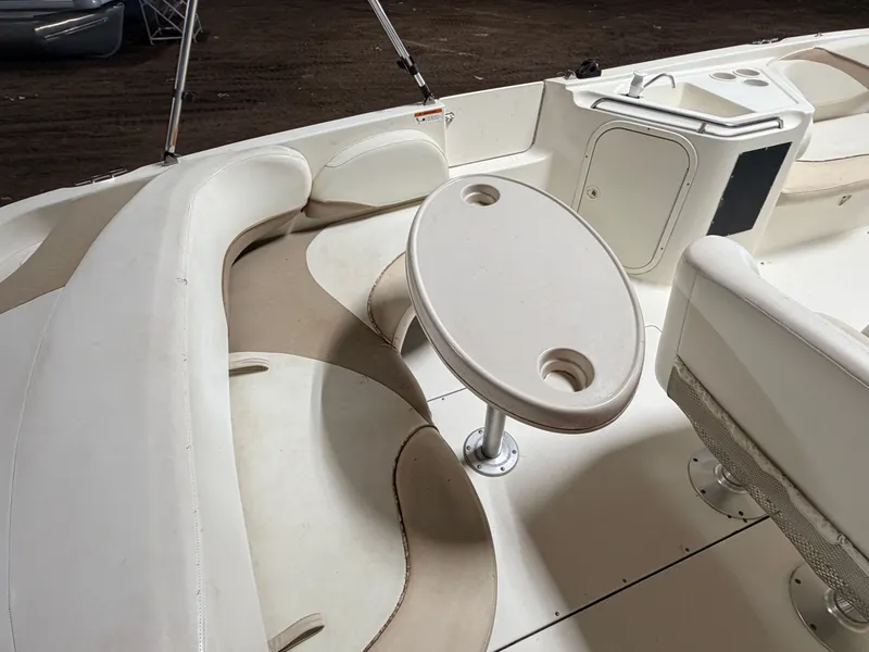 Slide: The Image of Interior view of a boat with an oval table and cushioned seating. - 39