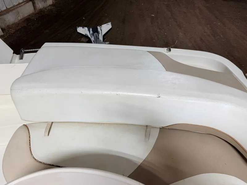 Slide: The Image of Close-up of a white and beige boat seat with sleek design. - 42