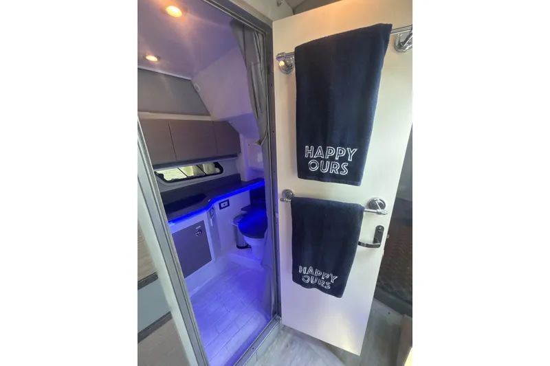 Slide: The Image of Interior of 2019 Formula 430 Super Sport Crossover with modern bathroom and "Happy Ours" towels. - 66