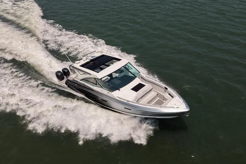 Slide: The Image of 2019 Formula 430 Super Sport Crossover cruising on open water. - 9