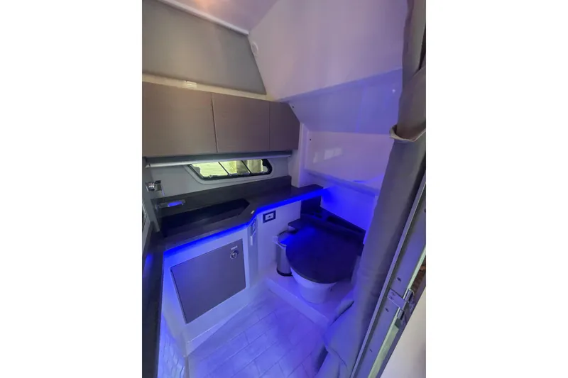 Slide: The Image of 2019 Formula 430 Super Sport Crossover interior with modern design and blue ambient lighting. - 67