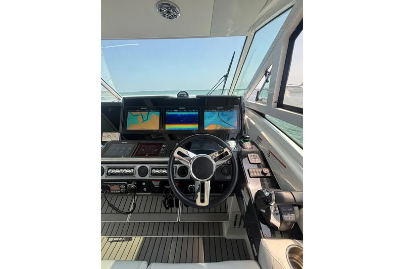 Slide: The Image of Cockpit of 2019 Formula 430 Super Sport Crossover with advanced navigation displays. - 43