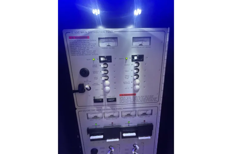 Slide: The Image of Control panel of a 2019 Formula 430 Super Sport Crossover boat, illuminated in blue light. - 72
