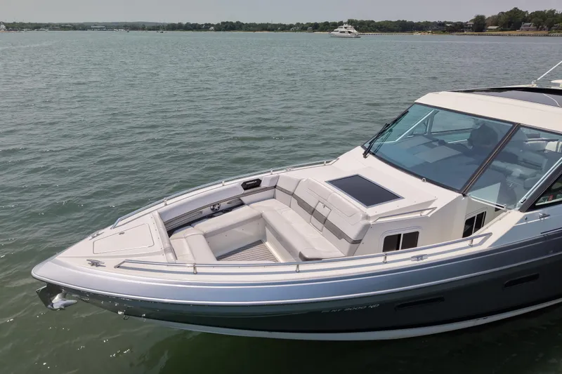 Slide: The Image of 2019 Formula 430 Super Sport Crossover boat on calm water, showcasing sleek design. - 14