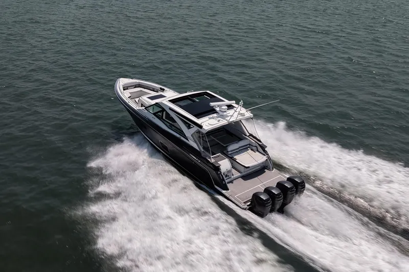 Slide: The Image of 2019 Formula 430 Super Sport Crossover speeding on open water, showcasing sleek design and powerful engines. - 24