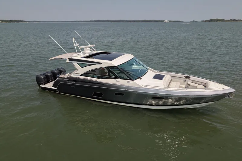Slide: The Image of 2019 Formula 430 Super Sport Crossover boat on calm water. - 0