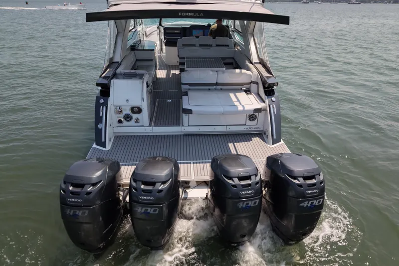 Slide: The Image of 2019 Formula 430 Super Sport Crossover with four powerful outboard engines on water. - 21