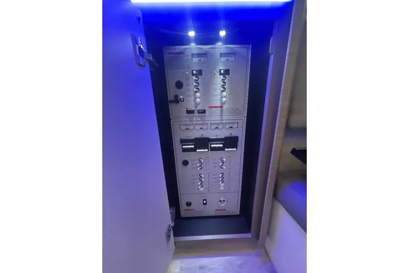 Slide: The Image of Control panel inside 2019 Formula 430 Super Sport Crossover boat, illuminated by blue LED lights. - 71