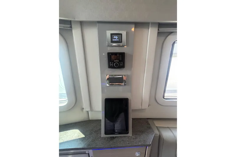 Slide: The Image of Control panel inside 2019 Formula 430 Super Sport Crossover yacht, featuring modern navigation equipment. - 77