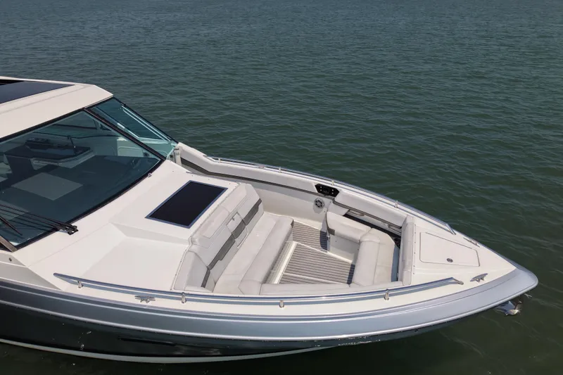 Slide: The Image of 2019 Formula 430 Super Sport Crossover boat on calm water, featuring sleek design and spacious seating. - 13