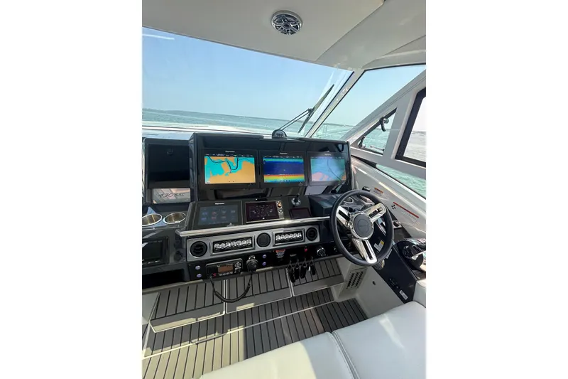 Slide: The Image of Cockpit of 2019 Formula 430 Super Sport Crossover with advanced navigation displays. - 40