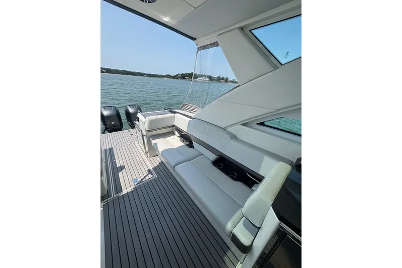 Slide: The Image of 2019 Formula 430 Super Sport Crossover boat interior with seating, overlooking water. - 37
