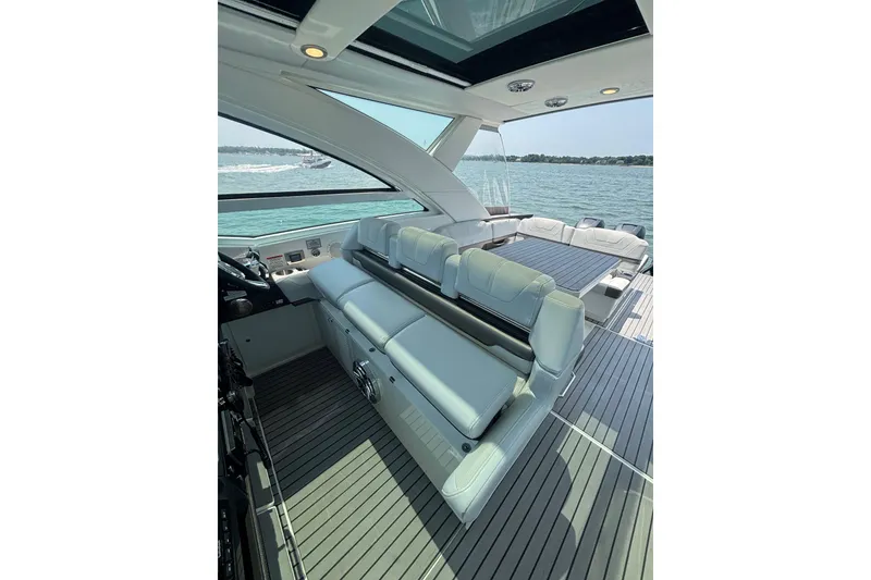Slide: The Image of 2019 Formula 430 Super Sport Crossover yacht interior with luxurious seating and scenic water view. - 34