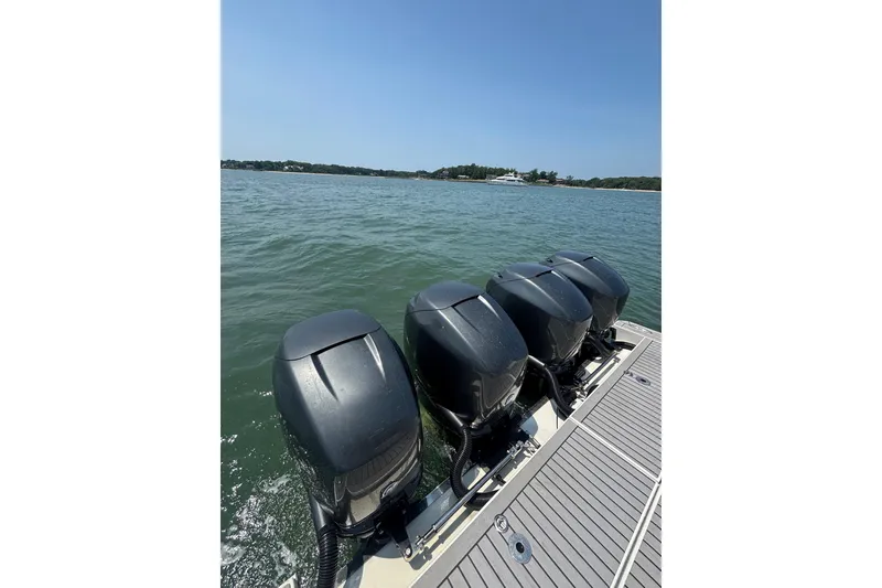 Slide: The Image of Four powerful outboard motors on a 2019 Formula 430 Super Sport Crossover boat. - 33