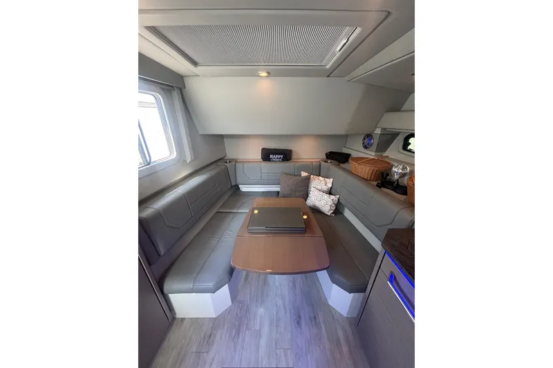 Slide: The Image of Interior of 2019 Formula 430 Super Sport Crossover with modern seating and table. - 61