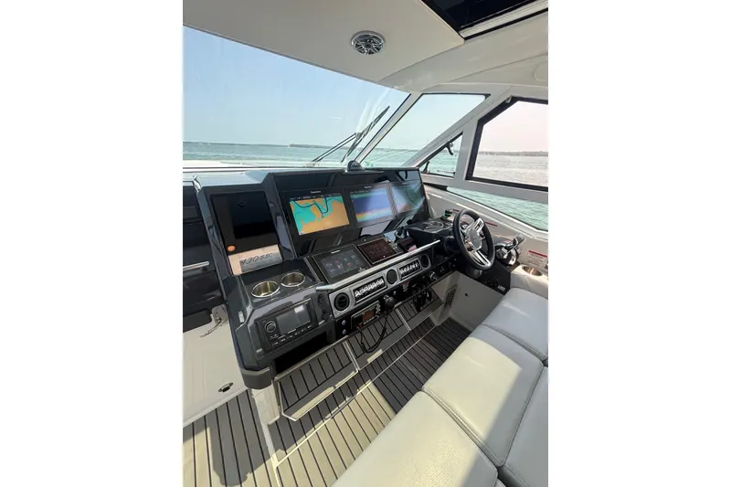 Slide: The Image of 2019 Formula 430 Super Sport Crossover helm with advanced navigation displays and luxurious seating. - 39