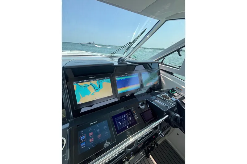 Slide: The Image of Cockpit view of 2019 Formula 430 Super Sport Crossover with navigation screens. - 44