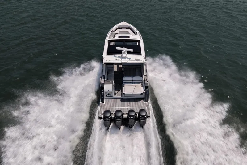 Slide: The Image of 2019 Formula 430 Super Sport Crossover speeding on open water, aerial view. - 12