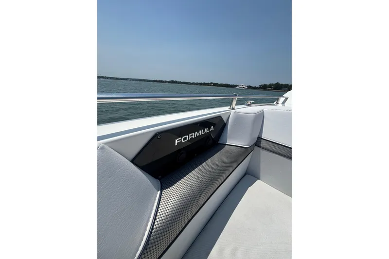 Slide: The Image of 2019 Formula 430 Super Sport Crossover boat interior with sleek seating and water view. - 51