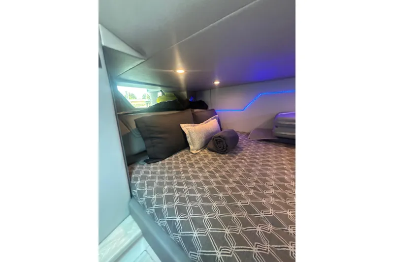 Slide: The Image of Cozy cabin interior of 2019 Formula 430 Super Sport Crossover with modern bedding and ambient lighting. - 69