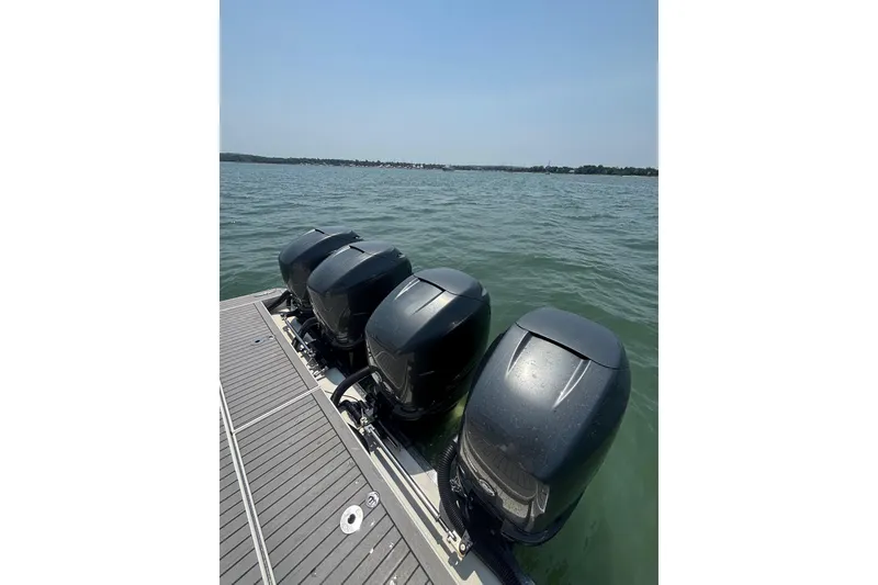Slide: The Image of Four powerful outboard motors on a 2019 Formula 430 Super Sport Crossover boat. - 32
