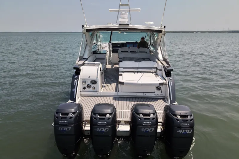 Slide: The Image of 2019 Formula 430 Super Sport Crossover with four powerful outboard engines on open water. - 17