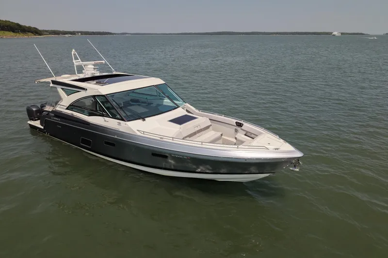 Slide: The Image of 2019 Formula 430 Super Sport Crossover boat on calm water. - 5