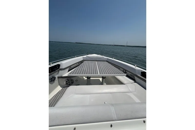 Slide: The Image of 2019 Formula 430 Super Sport Crossover boat on calm water, featuring sleek deck design. - 47