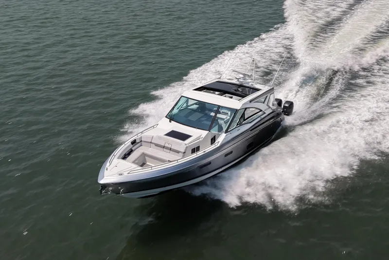 Slide: The Image of 2019 Formula 430 Super Sport Crossover cruising on open water, leaving a wake trail. - 23