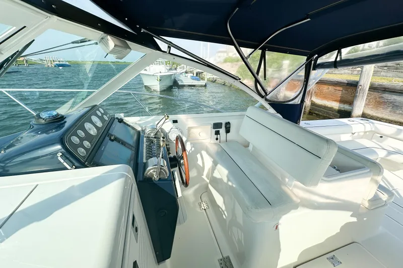 Slide: The Image of 2001 Tiara Yachts 2900 Coronet cockpit with helm, seating, and ocean view. - 12