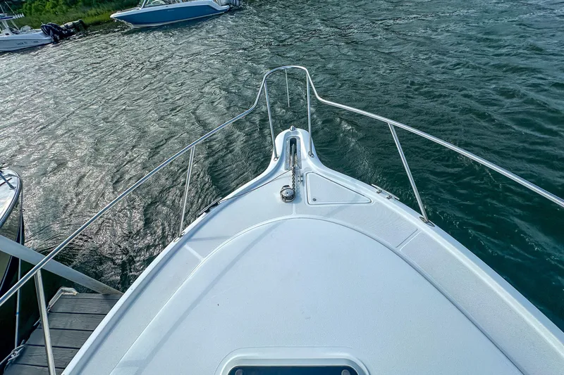 Slide: The Image of Bow view of 2001 Tiara Yachts 2900 Coronet on water, showcasing sleek design. - 32