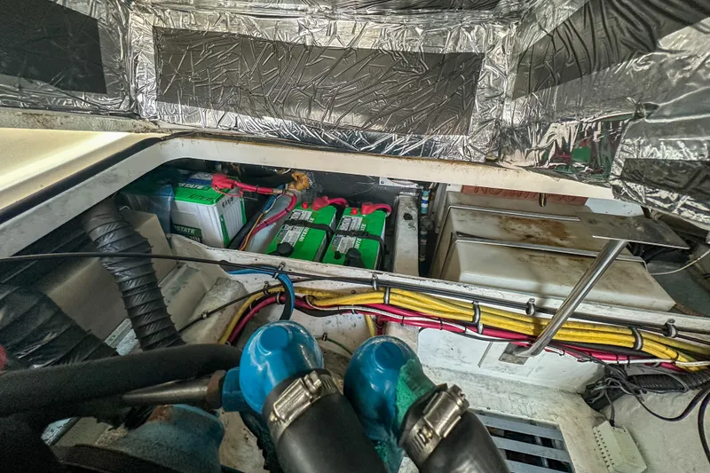 Slide: The Image of Engine compartment of a 2001 Tiara Yachts 2900 Coronet with visible batteries and wiring. - 29