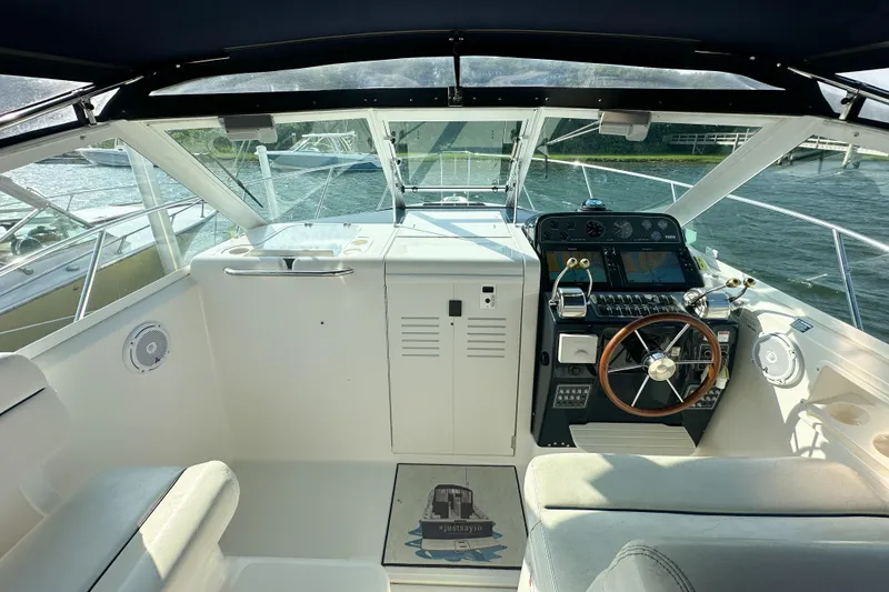 Slide: The Image of Cockpit of 2001 Tiara Yachts 2900 Coronet with steering wheel and navigation controls. - 18