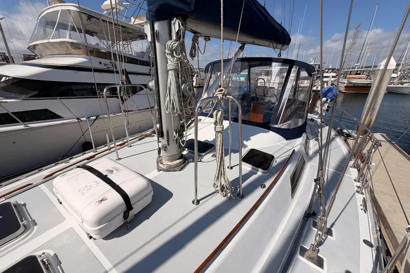 Slide: The Image of Sailboat deck of a 1991 Hylas 51, docked at a marina under clear skies. - 27