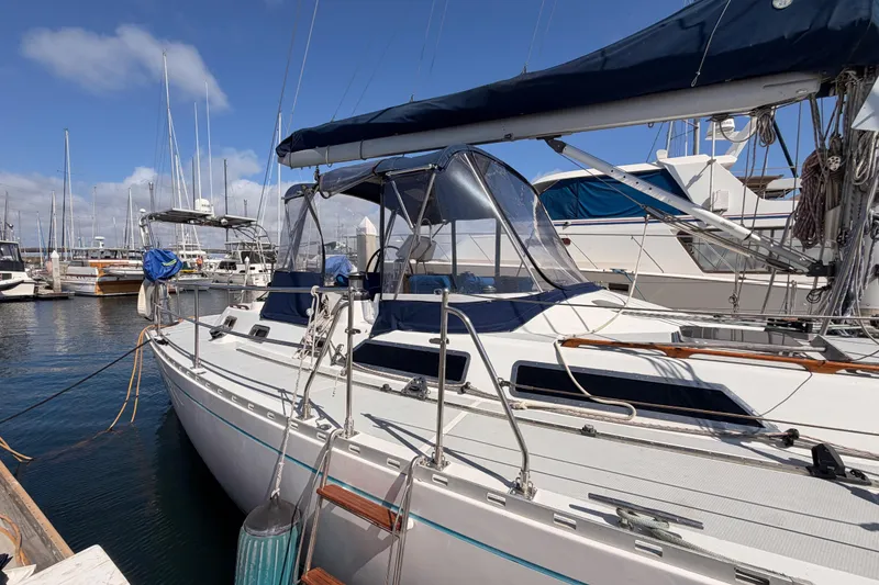 Slide: The Image of Sailboat docked at marina, Hylas 51 model, 1991, with blue canvas covers. - 6