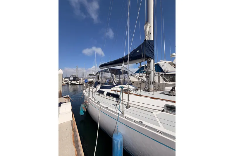 Slide: The Image of Sailboat docked at marina, 1991 Hylas 51, clear blue sky background. - 5