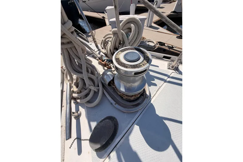 Slide: The Image of Deck of 1991 Hylas 51 sailboat with winch and coiled ropes. - 19