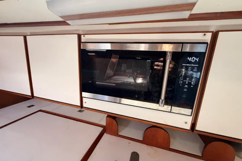 Slide: The Image of Built-in microwave in a 1991 Hylas 51 yacht kitchen interior. - 82