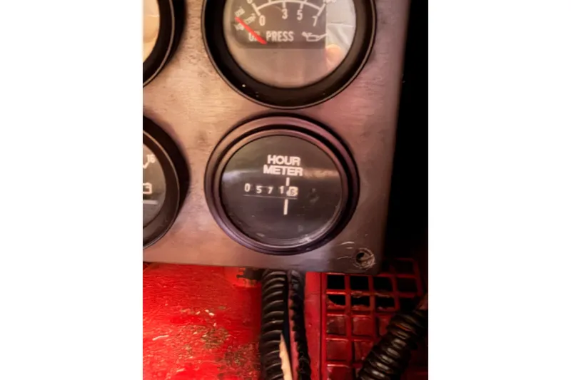 Slide: The Image of Hour meter reading 5718 on a 1991 Hylas 51 dashboard. - 116