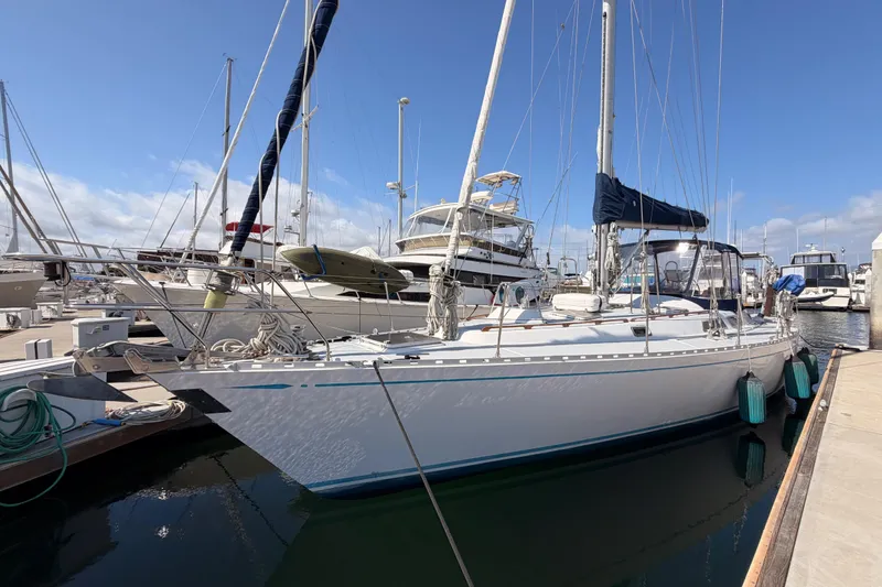 The Image of Sailboat docked at marina, 1991 Hylas 51 model, clear blue sky background. - 0