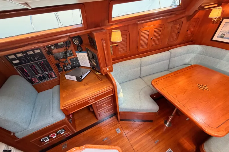 Slide: The Image of Cozy interior of 1991 Hylas 51 yacht with wooden furnishings and navigation equipment. - 50