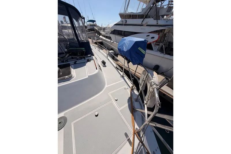 Slide: The Image of Sailboat deck view of a 1991 Hylas 51, docked at a marina. - 37