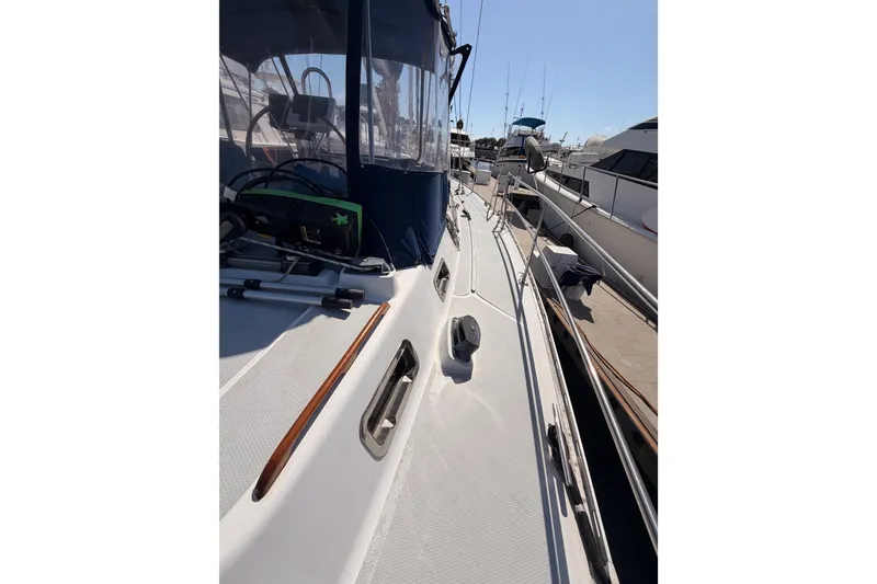 Slide: The Image of Sailboat deck view of 1991 Hylas 51, docked with clear skies. - 38