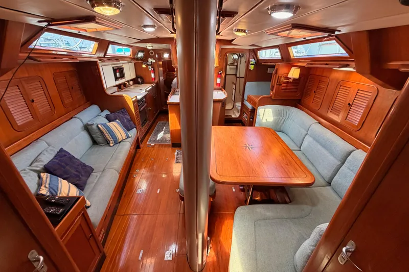 Slide: The Image of Luxurious 1991 Hylas 51 yacht interior with cozy seating and elegant wood finishes. - 107