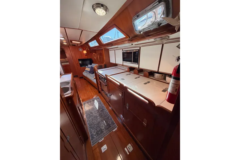 Slide: The Image of Interior of a 1991 Hylas 51 yacht with wood finishes and modern amenities. - 79
