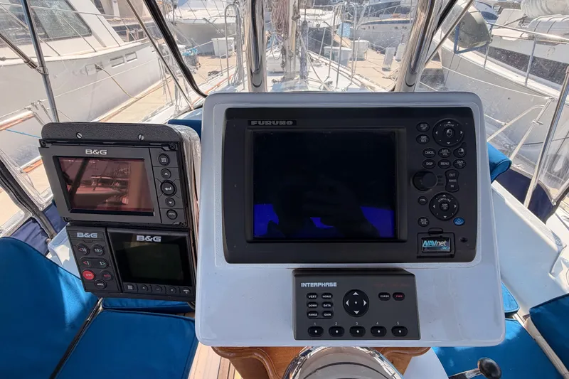 Slide: The Image of Cockpit navigation equipment on a 1991 Hylas 51 yacht, featuring B&G and Furuno displays. - 43