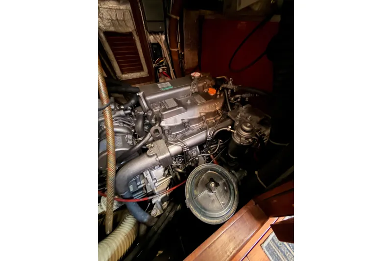 Slide: The Image of Engine compartment of a 1991 Hylas 51 yacht, showcasing detailed mechanical components. - 87