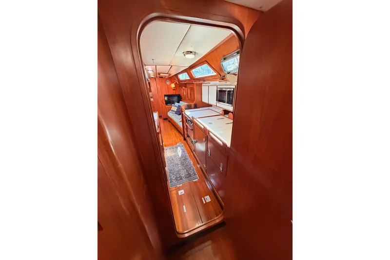 Slide: The Image of Interior view of 1991 Hylas 51 yacht, featuring wooden cabinetry and modern amenities. - 78