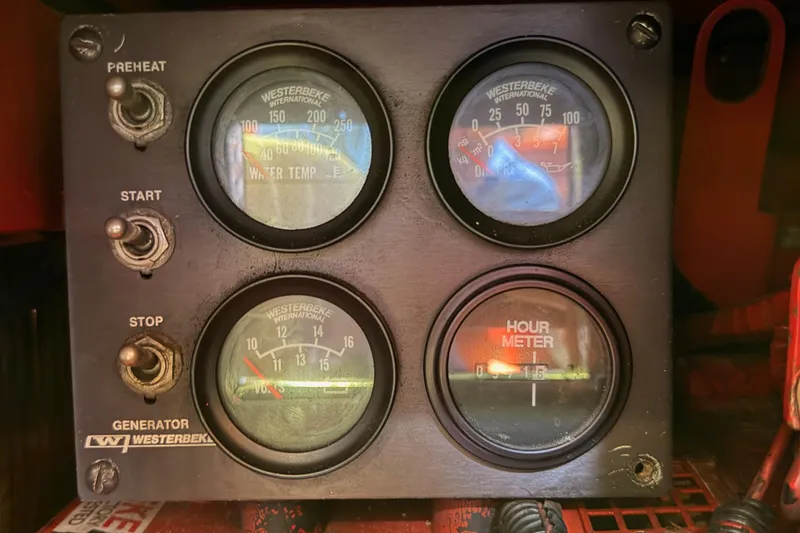 Slide: The Image of Control panel of a 1991 Hylas 51 with Westerbeke generator gauges and switches. - 111