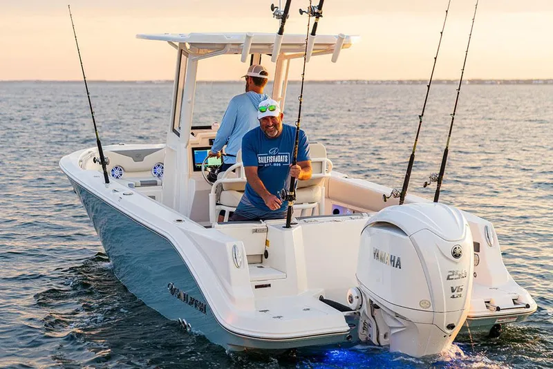 Slide: The Image of Manufacturer Provided Image: 2026 Sailfish 232 CC boat on water, two people fishing, Yamaha engine visible. - 2